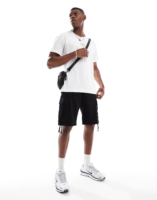 Model: 184.5cm / 6' 0'' | Wearing M - W31-34 Red Laze logo t-shirt in white